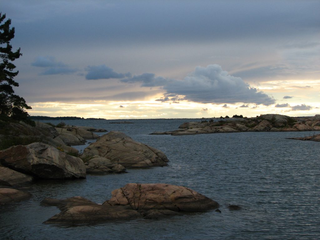 Waterfront photo of the cloudy sky. 