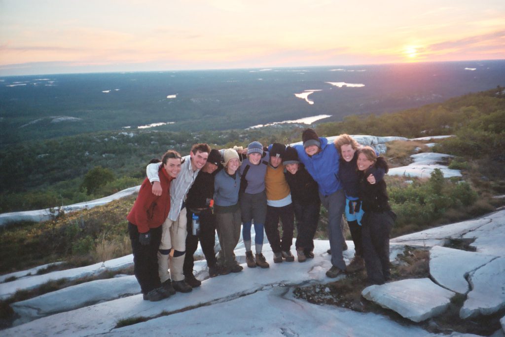 A patrol poses for their sunrise summit. 