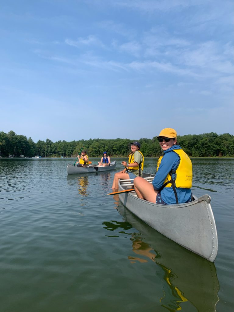 Leaders smile during canoe portion of program.