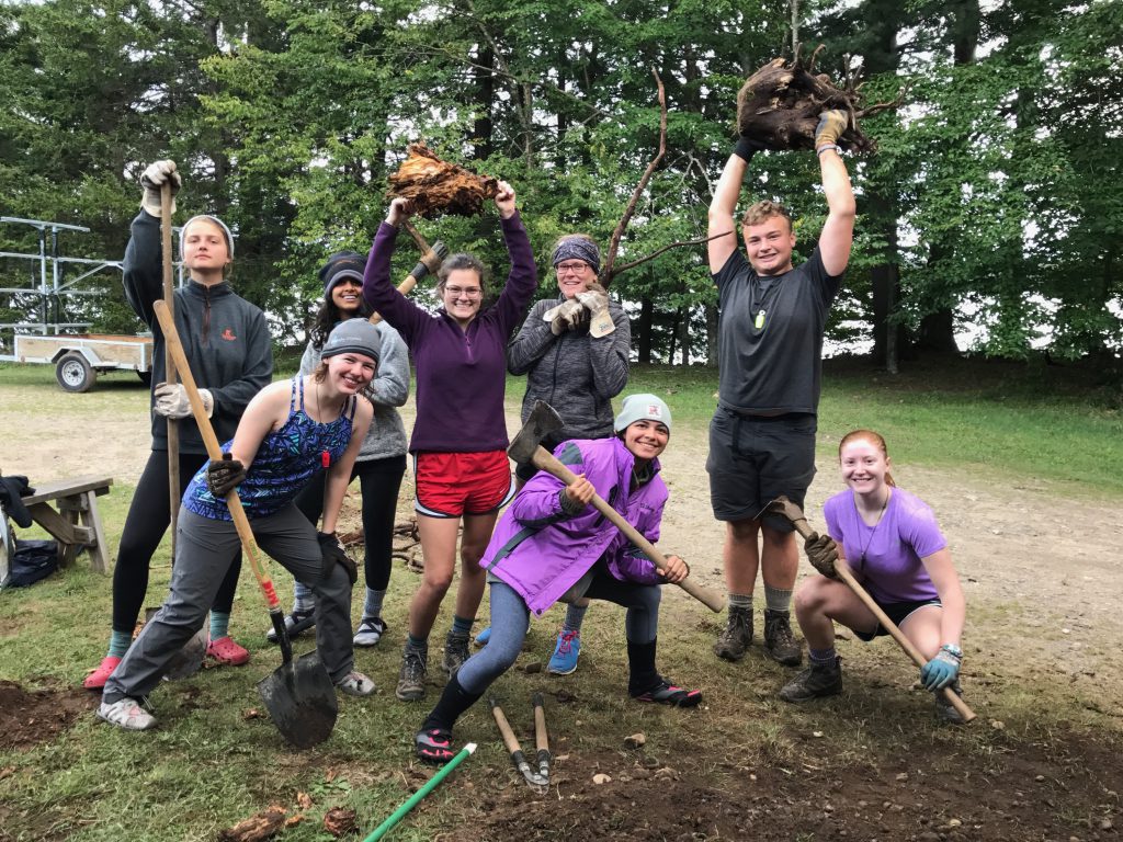 A service crew hard at work at Massawepie property with axes and shovels.