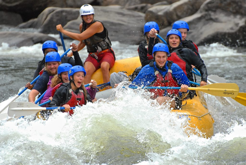 A group of rafters guided by Marney faces the rapids of the Hudson River. 