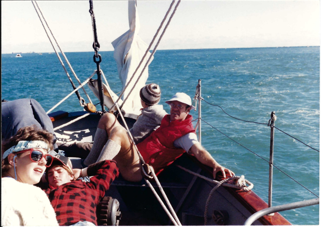 Group of men relaxes on the sailboat the playfair. 