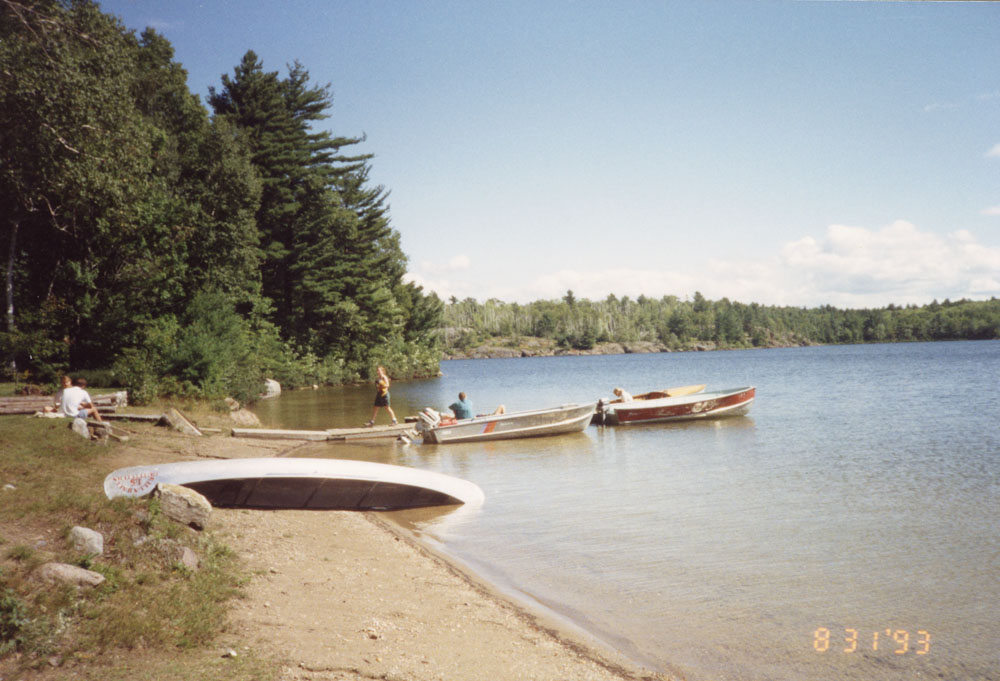 A few individuals prepare to launch some boats.