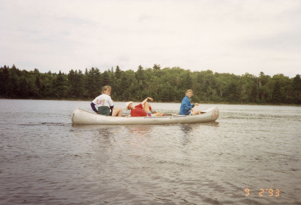 A canoe takes a break in the middle of the lake.