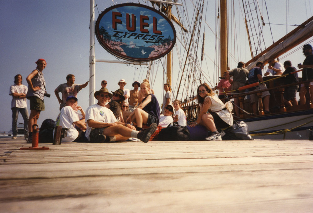 A group gets ready to depart on the sailboat.